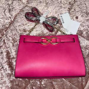 Hot pink clutch with shoulder strap